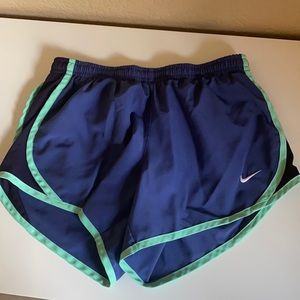 purple and green nike shorts